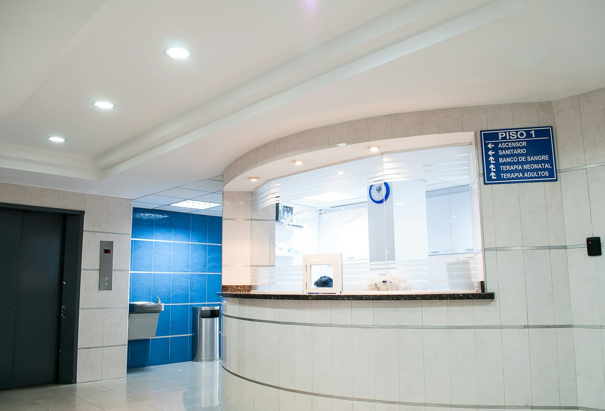 A clinic reception desk where patient insurance details are checked